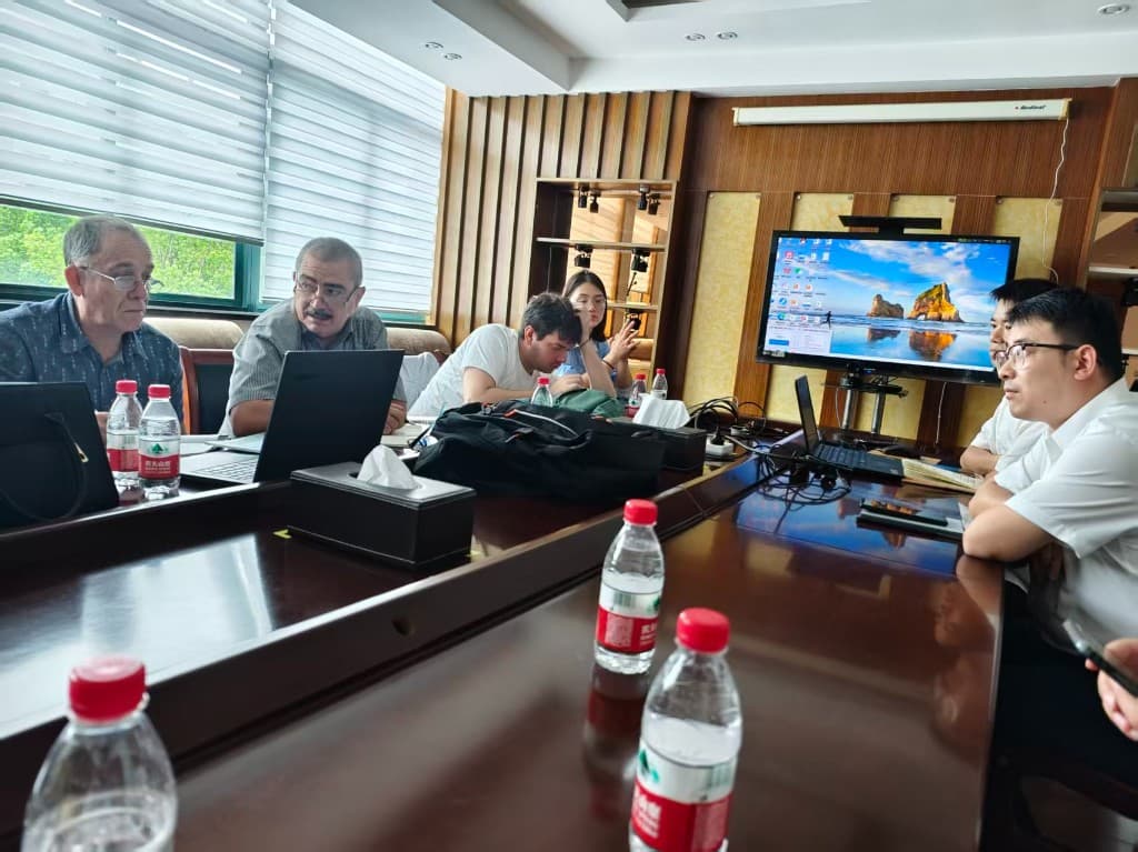 JURUN sales team in a conference room reviewing project specifications