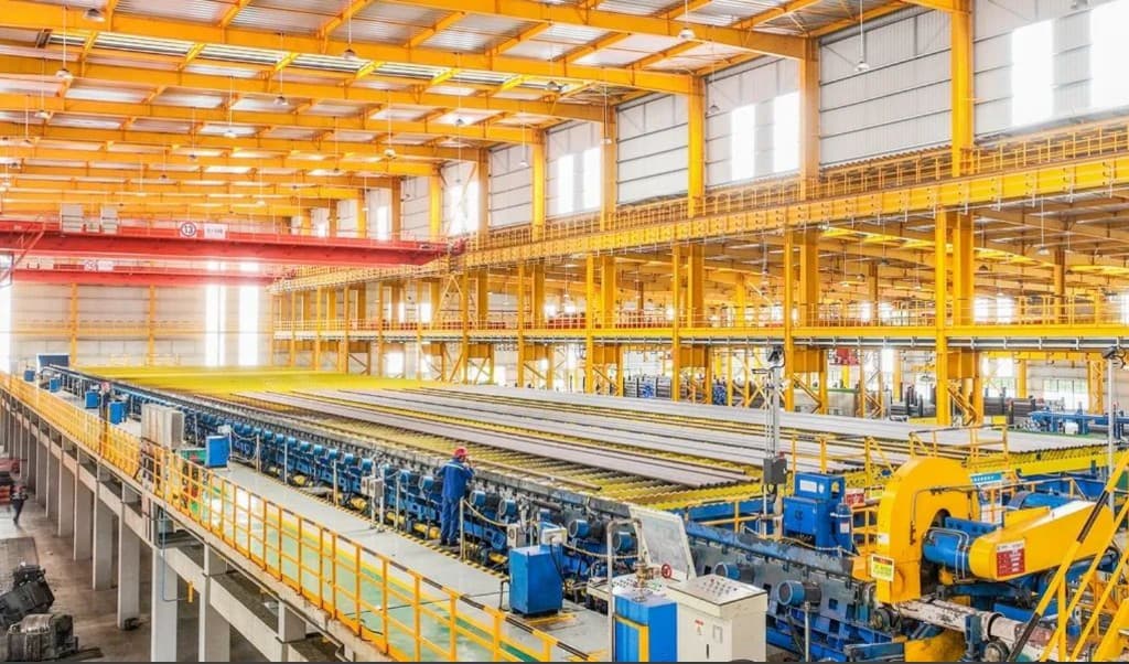 Seamless pipes spread across the sizing mill and cooling bed